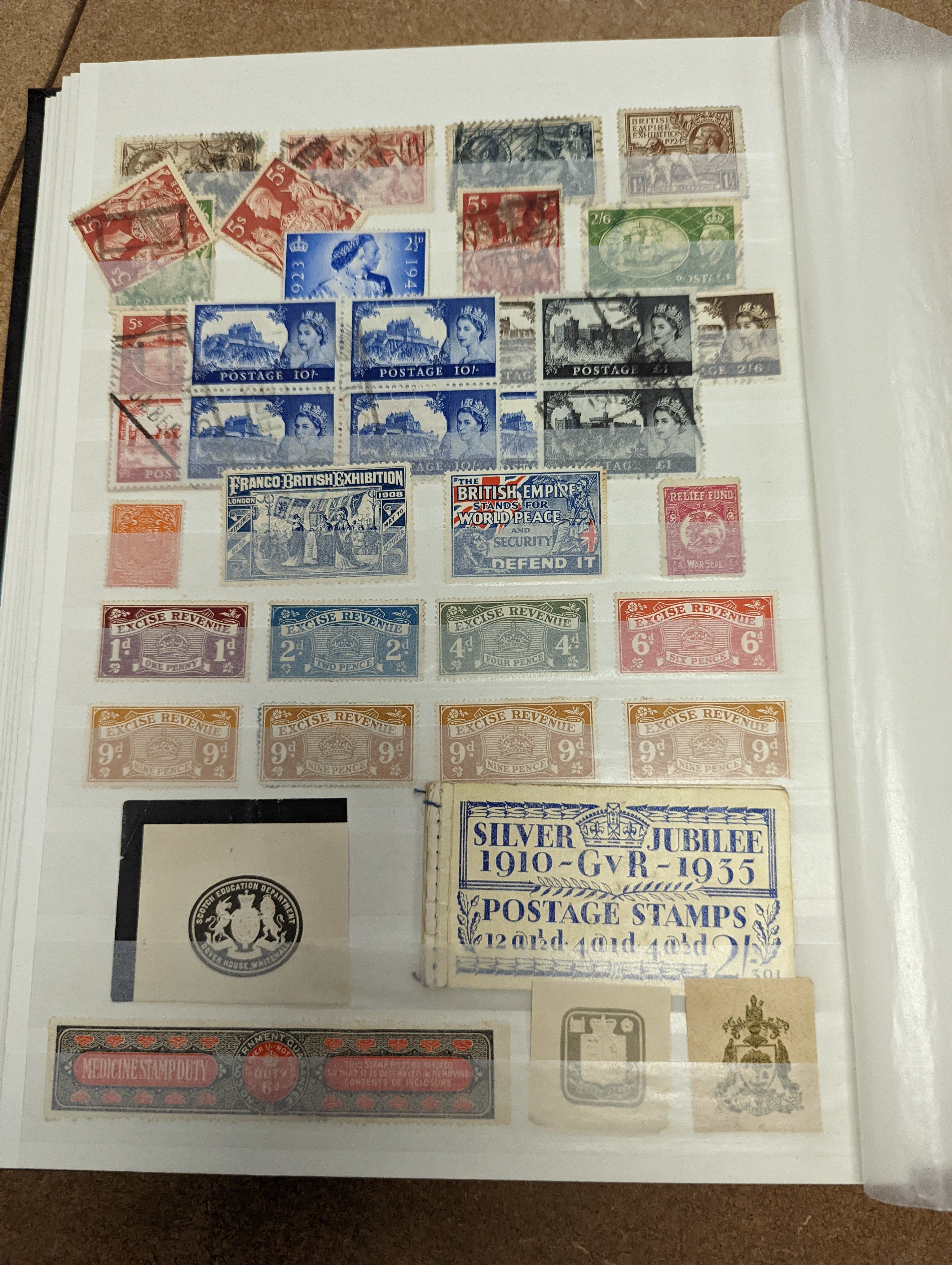 Great Britain stamps in stock book with 1840 1d black and 1841 2d blue unused. 1841 1d red brown mint block of 8, 1864-79 1d red plates in mint blocks including plate 79 block of 48, plate 170 block of 6 with marginal in